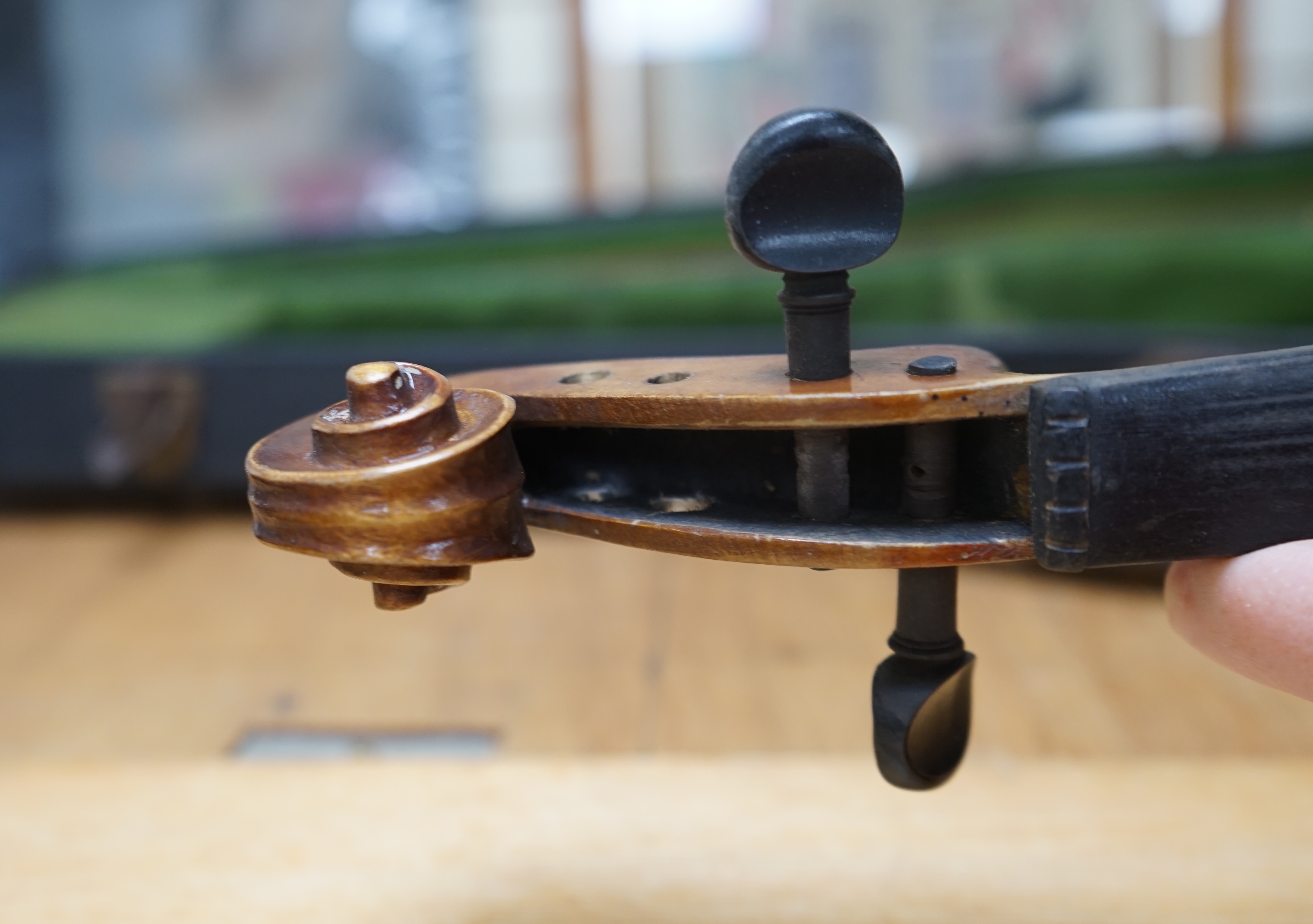 Early 20th century ¾ size violin, unlabelled, cased, together with a violin table, back and scroll. Condition - fair